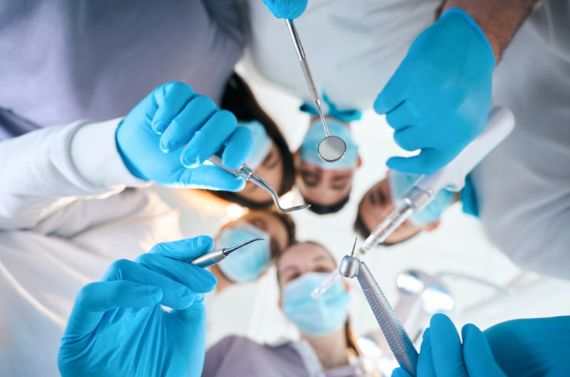 Dental team discussing modern full-arch implant treatment planning