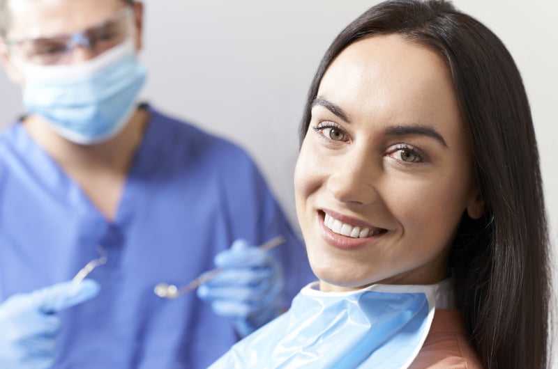 Patient undergoing a dental examination to determine All-on-X implant eligibility