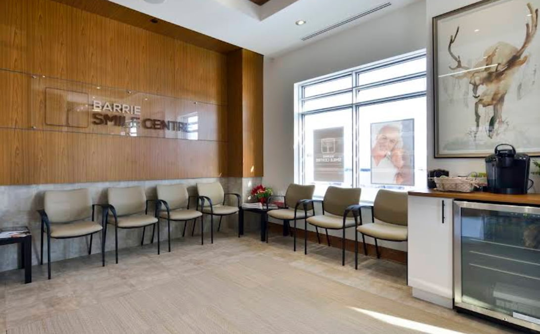 Modern waiting room at Barrie Smile Centre with comfortable seating, natural light, and a welcoming patient environment