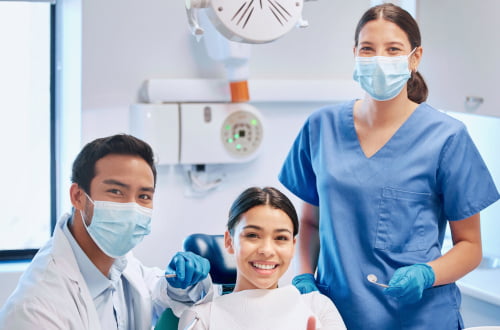 A dentist explaining eligibility for the Canadian Dental Care Plan to a patient