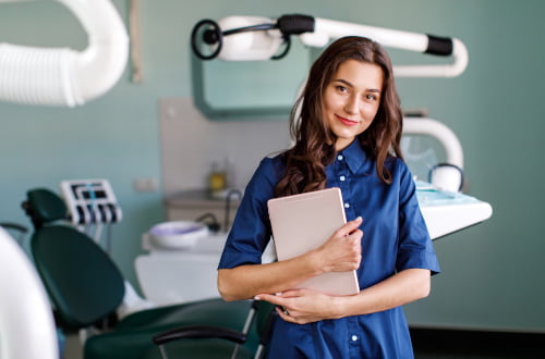 A dentist discussing treatment options and CDCP coverage with a patient during a dental consultation