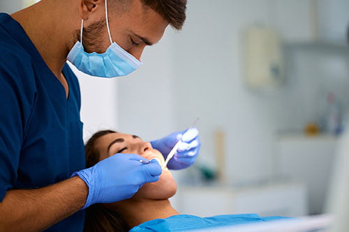 Dentist providing same-day emergency dental care to a patient in the Barrie clinic