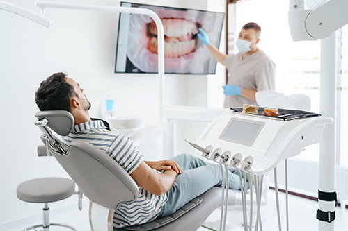 Dentist treating tooth infection and abscess during an emergency visit in Barrie