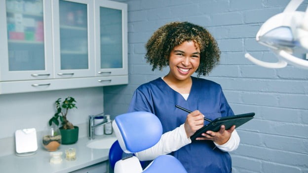 Dentist discussing veneers with a patient in a dental office