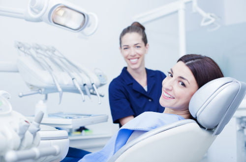 Dental hygienist performing professional teeth cleaning during a dental appointment