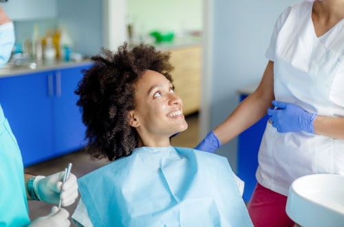 Dental hygienist cleaning a patient’s teeth during a professional dental appointment