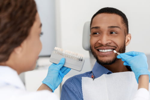 Dentist consulting patient for teeth bleaching and whitening options in Barrie