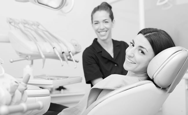 Woman receiving a professional dental cleaning during a routine hygiene appointment in Barrie