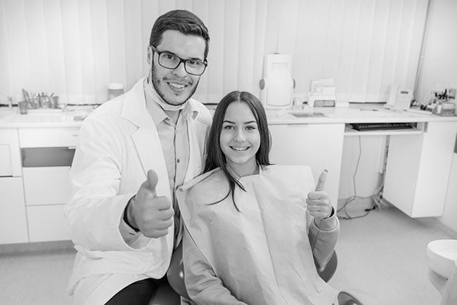 A dentist and a patient smiling after a preventive dental care appointment at a dental clinic in Barrie