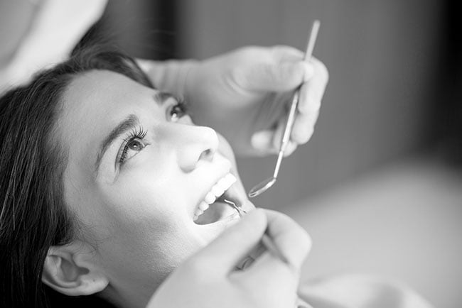 Patient undergoing a professional teeth whitening consultation and dental examination in Barrie