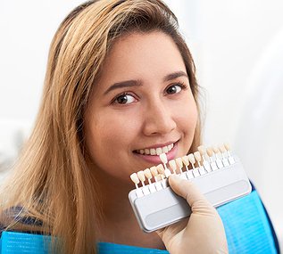 Young patient visiting a dentist for a cosmetic dental consultation related to porcelain veneers and smile enhancement treatment