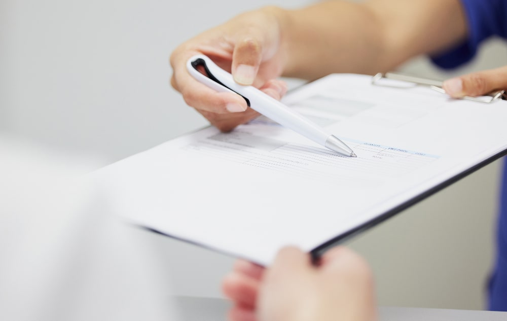 Dental insurance consultation discussing policy coverage, premiums, and benefits